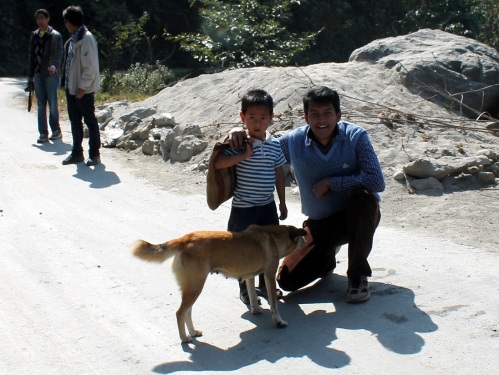 With a local kid, as a dog inspects me - On the way to Lachung, Sikkim